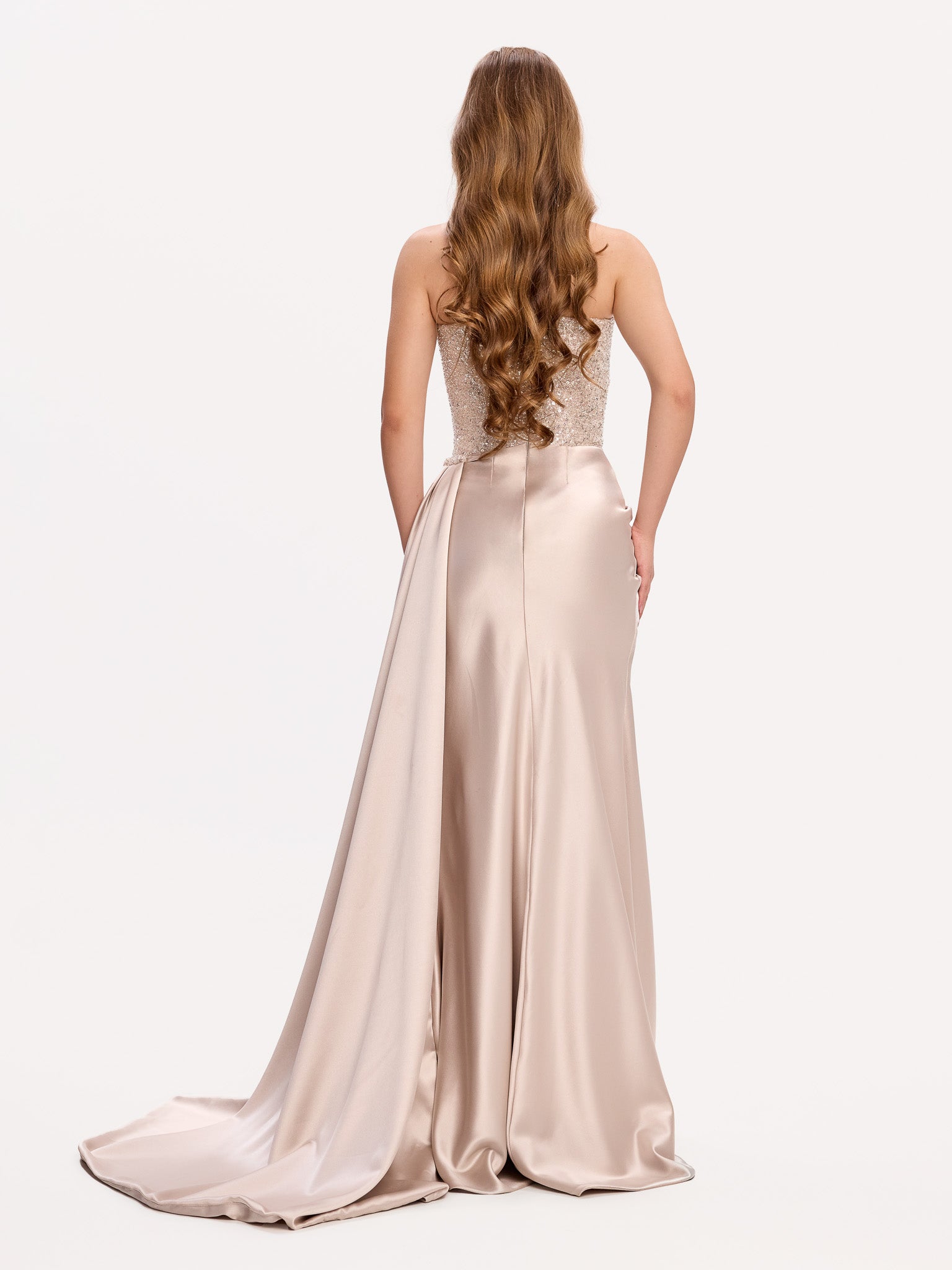 Embellished evening gown with draped skirt